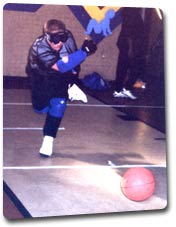 Boy rolling goalball